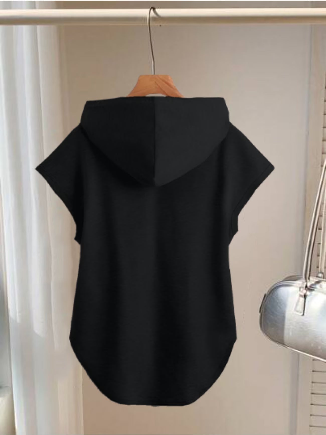 Sleeveless Hoodie Featuring a Cartoon Lip Biting a Key Design