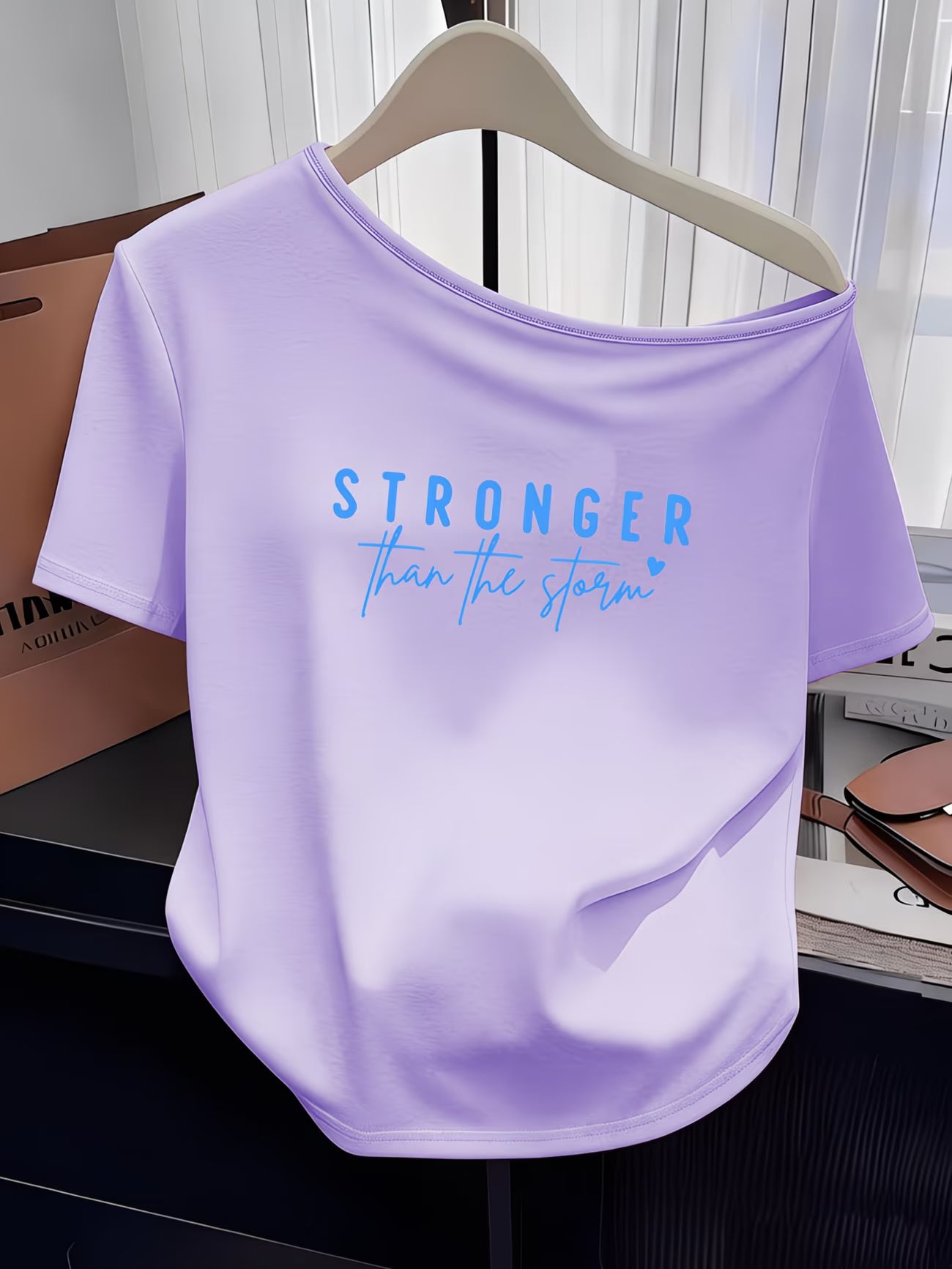 Women's Y2K Off-Shoulder Tee – "Stronger Than The Storm" Slogan Print