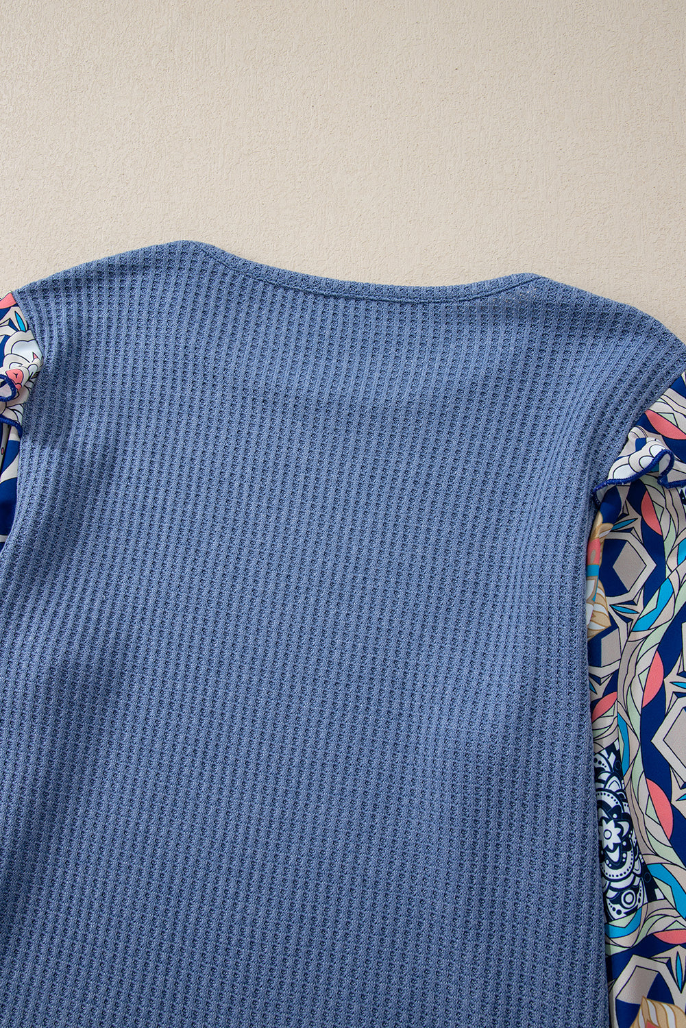 Blue O-Neck Waffle Knit Blouse with Floral Sleeves and Ruffles