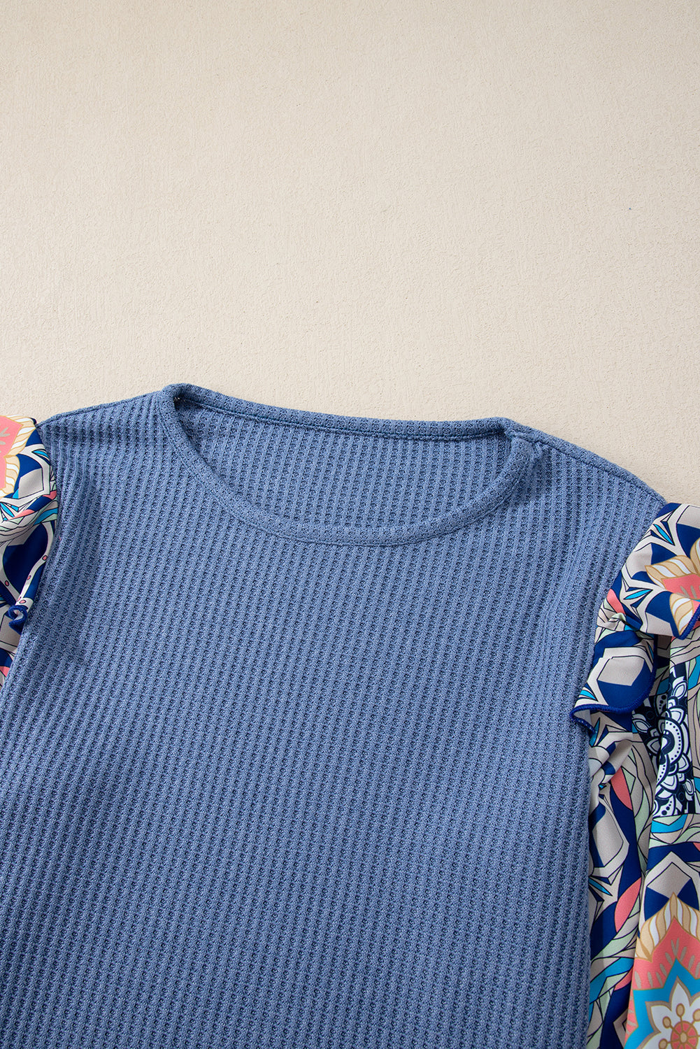 Blue O-Neck Waffle Knit Blouse with Floral Sleeves and Ruffles
