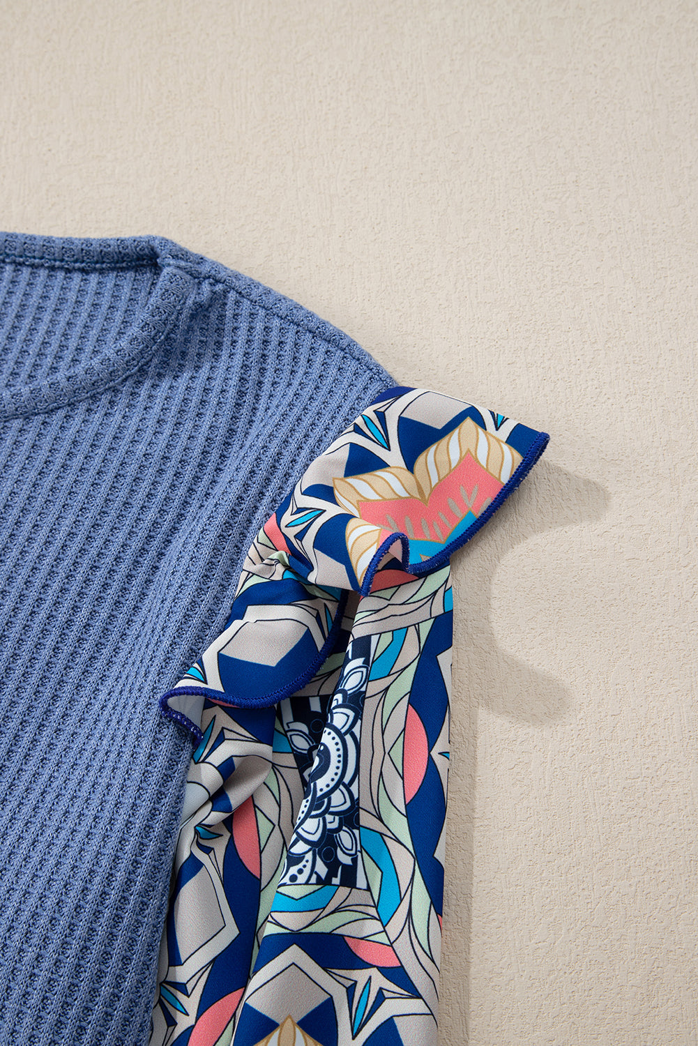 Blue O-Neck Waffle Knit Blouse with Floral Sleeves and Ruffles