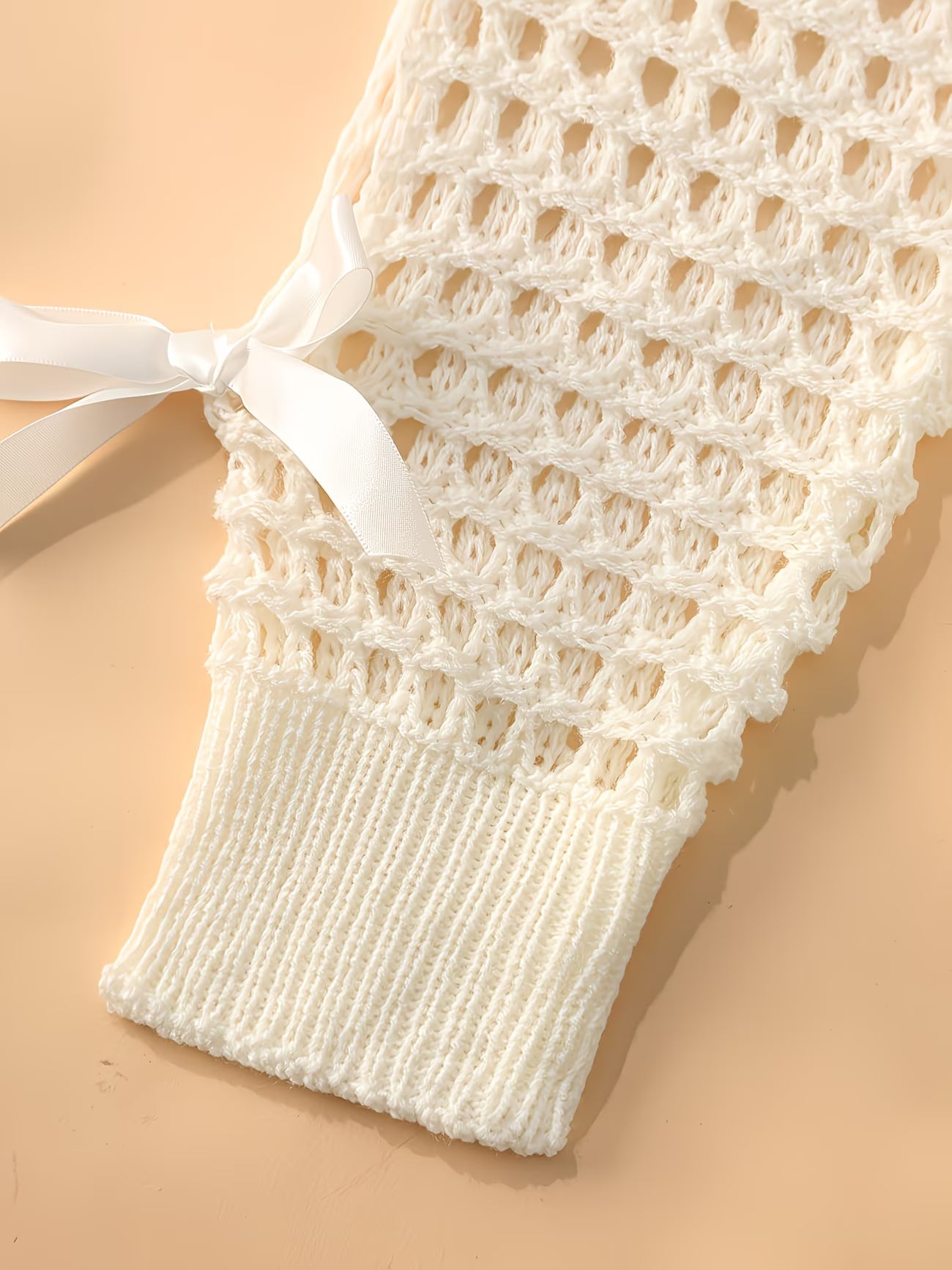 Hollow-Out Cover-Up Sweater with Bow Detail